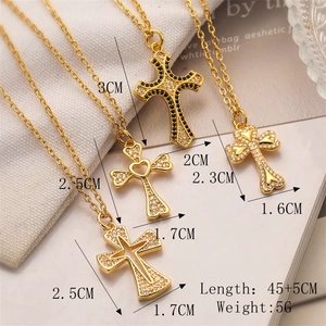 Close-up of 18K gold-plated cross necklaces with cubic zirconia and dimension labels