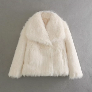 Detail of white faux fur coat with oversized lapel collar on a textured background