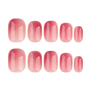 Pink gradient short oval press-on nails with a glossy finish on a white background