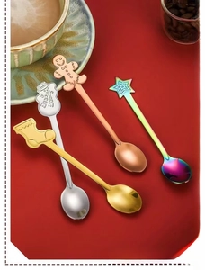 Set of four Christmas stainless steel spoons with snowman and gingerbread man handles