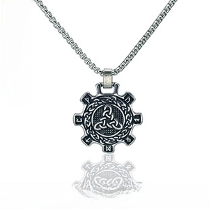 Detailed view of Celtic Triquetra pendant with Nordic rune symbols in vintage silver finish