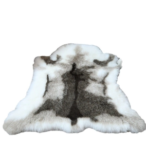 Faux reindeer fur rug with modern irregular shape and soft grey plush texture for bedrooms