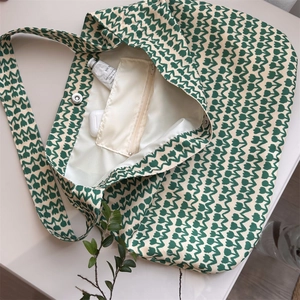 Detailed interior of floral cotton tote bag showing magnetic buckle and zipper pocket