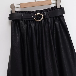 High-waisted black leather skirt with matching belt and golden oval buckle detail