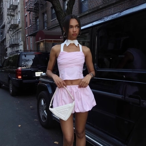 Y2K pink striped two-piece set featuring halter neck top and drawstring pumpkin shorts