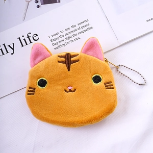 Close-up of cute plush cat coin purse with detailed orange embroidery and silver bead chain