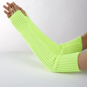 Detail of neon green ribbed knit arm warmers with thumb holes and elastic texture