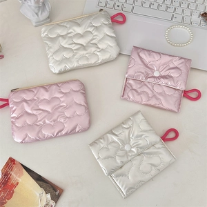 Chic quilted heart makeup pouches in metallic pink and silver with stylish wrist loops