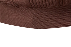 Close-up of brown knit sweater showing high-quality ribbed collar and fabric texture