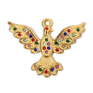 Close-up of golden eagle pendant with colorful zircons and intricate wing details