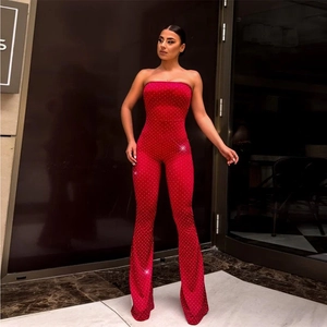 Close-up of red tube top jumpsuit featuring sparkling rhinestones and wide leg cut