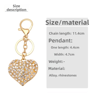Detailed view of crystal heart keychain showing dimensions 4.4cm by 4.7cm and chain length