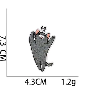 Detailed view of grey cat embroidery patch with dimensions 7.3cm x 4.3cm and 1.2g weight