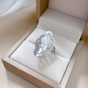 Silver spider lily hollow titanium steel ring displayed in a premium jewelry box