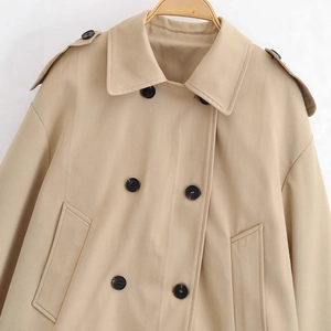 Classic khaki double-breasted short trench coat for women with stylish black decorative buttons