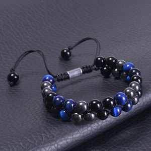 Detail of double-layer bracelet with blue tiger eye, black agate and adjustable slider