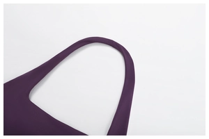 Detail of high-stretch dark purple knit fabric and seamless shoulder strap of sports bra