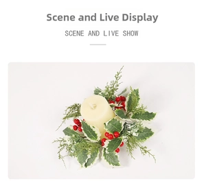 Detailed view of a Christmas candle ring with red berries and snowy holly leaves