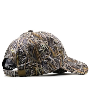 Detail of adjustable brass metal buckle and camouflage pattern on baseball cap back
