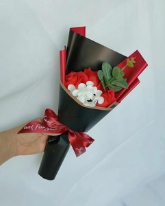 Detail of red soap rose bouquet with hydrangea and Just for you ribbon wrap