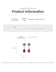 Vue détaillée de boucles d'oreilles vintage fleurs et zircons rouges en forme de goutte