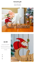 Close-up of wooden Merry Christmas tabletop ornament with red Santa Claus and log texture