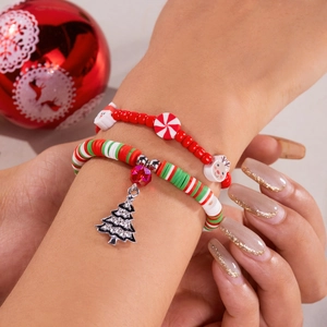 Fashionable Christmas beaded bracelet set with clay beads, snowman and tree charms on model