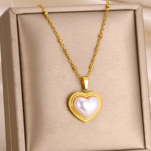 Luxurious gold stainless steel necklace featuring a large heart-shaped pearl pendant