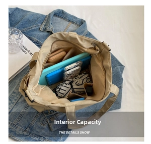 Detailed interior of a beige canvas tote bag showing spacious compartments and daily items