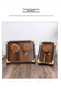 Detail of walnut wood jewelry trays with gold corners and brown velvet cushion pads