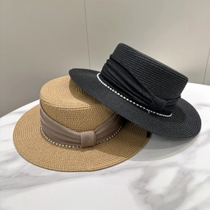 Flat top straw sun hats in black and khaki with pearl trim decoration shown from a 45-degree angle
