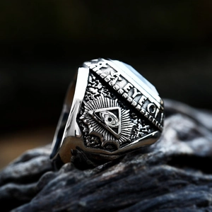 Macro detail of vintage Freemason ring showing Eye of Providence and side engraving