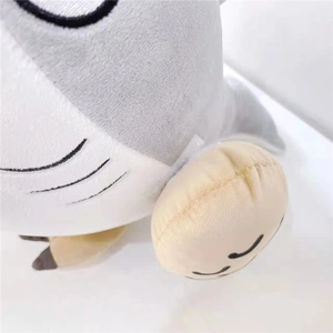 Macro detail of plush shark toy fabric showing soft texture and embroidered stitching