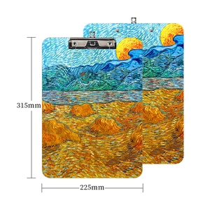 Macro detail of A4 wood clipboards with impressionist oil painting art prints