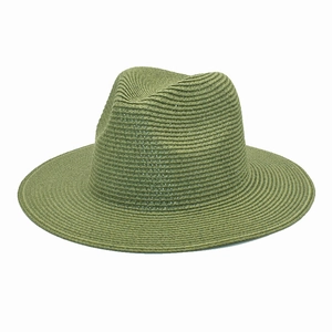 Macro detail of the olive green straw fedora showing fine spiral weave texture