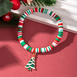 Macro shot of Christmas polymer clay bracelet with colorful beads and enamel tree charm