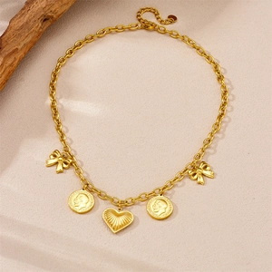Gold-plated stainless steel necklace with coin, heart, and bow pendants on a textured chain