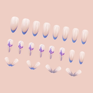 Almond press-on nails with purple butterfly art and glitter gradient design