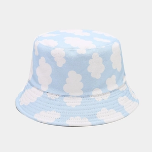 Unisex canvas bucket hat with blue sky and white cloud pattern for outdoor spring wear