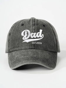 Detailed view of grey washed cotton baseball cap with Dad EST 2026 embroidery