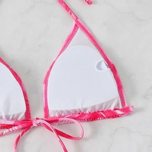 Detail of pink tie-dye bikini top showing inner lining and removable pad insert slot