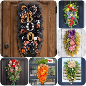 Various Christmas and seasonal decorative wreaths including festive LED pine and floral designs