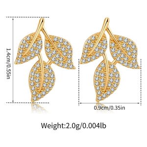 Leaf clover earrings with cubic zirconia and gold plating including size and weight specs