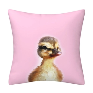 Close-up of cute cartoon duck digital print on pink decorative pillow cover
