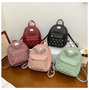 Detailed group view of colorful mini backpacks with metal rivets and PU leather texture