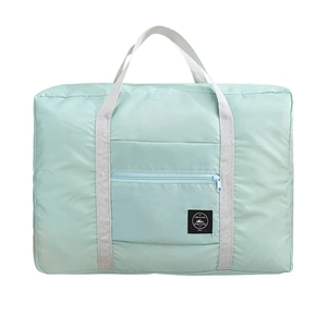 Mint green foldable travel duffel bag with front zipper pocket and grey handles