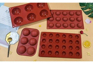 Detailed view of flexible semi-sphere silicone molds for chocolate and mousse baking