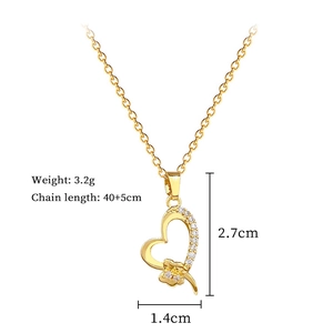 Detail of gold titanium heart necklace showing dimensions 2.7cm and weight 3.2g