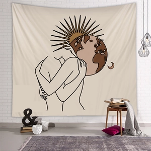 Minimalist line art tapestry featuring hugging couple and sun on a white brick wall