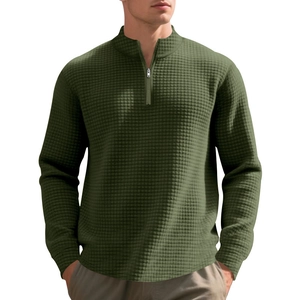 Close-up of military green waffle knit texture and quarter-zip stand collar on men's sweatshirt